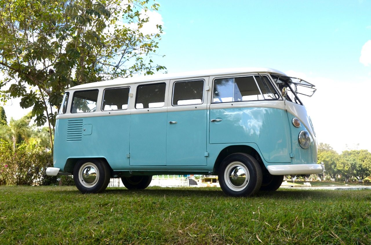 The light blue Volkswagen bus parked on grass in 2019